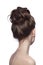 Back of slim woman with fancy prom hair bun