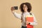 Back to college or university after quarantine and photo for blog. Happy african american lady in glasses, with backpack