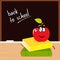 Back to school: apple, books and black board