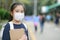 Back to school. asian child girl wearing face mask with backpack  going to school .Covid-19 coronavirus pandemic.New normal