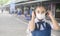 Back to school. asian child girl wearing face mask with backpack going to school. Covid-19 coronavirus pandemic. New normal