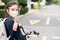 Back to school. asian child girl wearing face mask  and giving thumb upwith backpack biking a bicycle and going to school .Covid-
