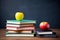 Back to school background with books and apples over blackboard. Stack of school books on the table. AI Generated