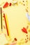 Back to school background with various red and yellow stationery