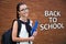 Back to school - beautiful smiling teenage girl with backpack