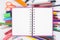 Back to school Blank Sketch book and school colorful tools on white background