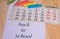 Back to school, calendar, colored chalk on wooden background