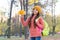 Back to school. childhood happiness. beauty of fall nature. happy kid wear sweater and hat. teen girl gathering fallen