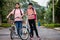 Back to school.Children Asia riding on bikes in the park near school