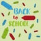 Back to school , colored pencils icons with funny text , on green background