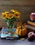 Back to school concept, autumn group composition with sunflowers, pumpkins, apples, fall leaves