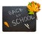 Back to school concept. Black chalkboard with pieces of chalks a