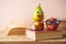 Back to school concept with books, funny cute apple, pear and school bus on wooden table