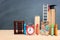 Back to school concept. image of two kids standing next to ladder and book over wooden desk