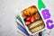 Back to school concept. Lunch box with sandwich, croissants and snacks for school. School background with the inscription ABC,