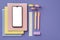 Back to school concept. Top view photo of school supplies smartphone over stack of copybooks colorful pens ruler eraser and