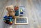 Back to school concept with Top view teddy bear standing on wooden floor next to stack of kid socks, Chalkboard, Colour pencils