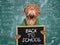 Back to school. Cute puppy and blackboard with inscription