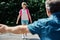 Back to school. Dad meets a child, a girl, a daughter from school. A joyful student runs to his parents. Fatherhood, parenthood