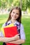 Back to school. Education concept. Cute smiling schoolgirl outdoor. Happy little girl child with backpack