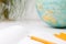 Back to school and education concept. school office supplies pencils, paper, notebook and globe on boke background. for educationa