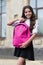 Back to school essentials I need. Happy child hold schoolbag outdoors. Little child wear uniform. Back to school fashion