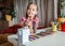 Back to school. Girl sharpening colorful pencils with a mechanical sharpener