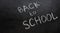 Back to School hand drawm text on a black background with  a white chalk. Copy space