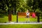 Back to school. Happy cute industrious child sitting on the bench and looking thoughtfully to the side. Concept of