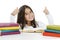 Back to school and happy time! Smiling schoolgirl sitting close to pile of books, showing Ok signs.