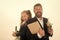 Back to school. Kid and dad hold microscope, book and stationery