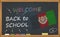 Back to school with learning and childhood concept. Banner with an inscription with the chalk welcome back to school and the Afgha