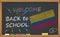 Back to school with learning and childhood concept. Banner with an inscription with the chalk welcome back to school and the Colom