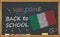Back to school with learning and childhood concept. Banner with an inscription with the chalk welcome back to school and the Italy