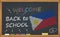 Back to school with learning and childhood concept. Banner with an inscription with the chalk welcome back to school and the Phili