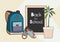 Back to school lettering vector illustration. Backpack, chalkboard, sneakers and green plant vector isolated set