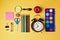Back to school objects organized on yellow background. View from above