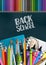 Back to school poster with colorful supplies - coloring pencils, pen, brushes, markers, ring notebooks, crayons