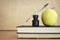 Back to school: Quill pen, books and an apple