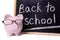 Back to school reminder, piggybank, blackboard, education costs concept