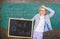 Back to school special offer. Special offer discount sale school season. Woman teacher holds blackboard back to school