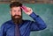 Back to school and studying. Teacher bearded man with pink stapler chalkboard background. Pin it on mind. Teaching
