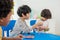 Back to school and summer course. Little children play colorful balloon in kindergarten class