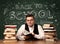 Back to school teacher sitting at classroom desk