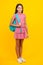 Back to school. Teenage school girl ready to learn. School children on yellow isolated background.