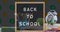 Back to school text on black board against color palette  and geometrical instruments icon