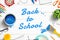 Back to School text painted with brush on white wooden desk