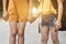 Back to school, Two sister pupil with backpack holding hand and going to school together.