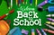 Back to school vector banner background. Welcome back to school text with colorful education supplies like crayons and pens.