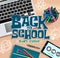 Back to school vector concept design. Back to school start online text with elements like laptop, phone and notebook.